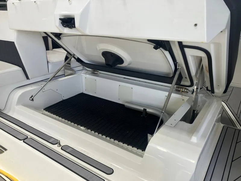 Slide: The Image of Open storage compartment in 2023 Monterey 385 Super Sport boat, showcasing spacious interior. - 38