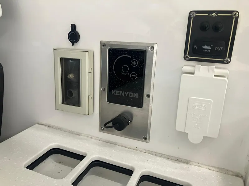 Slide: The Image of Control panel on 2023 Monterey 385 Super Sport boat featuring Kenyon system and outlets. - 41