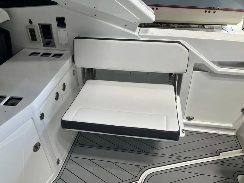 Slide: The Image of 2023 Monterey 385 Super Sport boat interior with white seating and sleek design. - 43