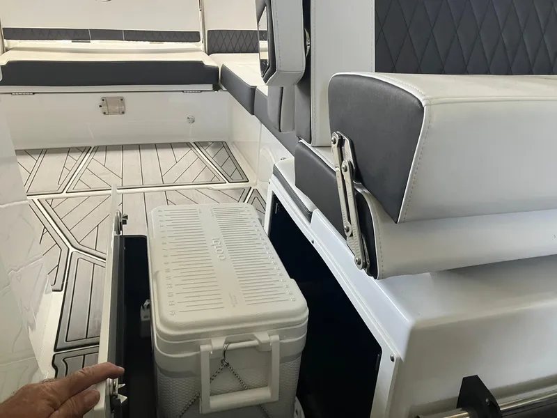 Slide: The Image of 2023 Monterey 385 Super Sport interior with storage compartment and cooler. - 45