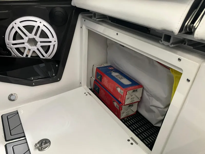 Slide: The Image of Storage compartment in 2023 Monterey 385 Super Sport boat with speaker and supplies. - 46