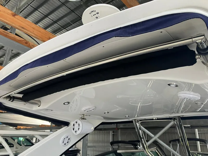 Slide: The Image of 2023 Monterey 385 Super Sport boat canopy and speakers in a storage facility. - 48