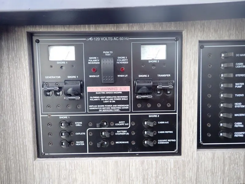 Slide: The Image of Electrical control panel on a 2023 Monterey 385 Super Sport boat. - 6
