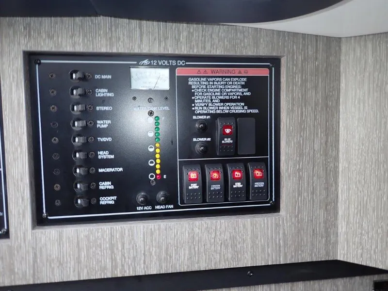 Slide: The Image of Control panel of a 2023 Monterey 385 Super Sport boat, featuring various switches and indicators. - 7