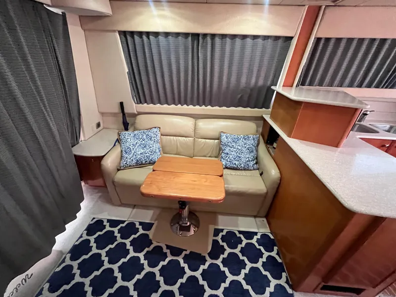 Slide: The Image of Interior of 2003 Meridian 381 Sedan with sofa, table, and patterned rug. - 11