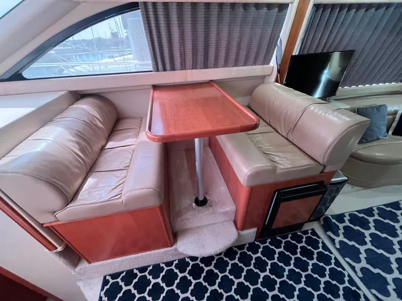 Slide: The Image of Luxurious 2003 Meridian 381 Sedan interior with leather seating and wooden table. - 12