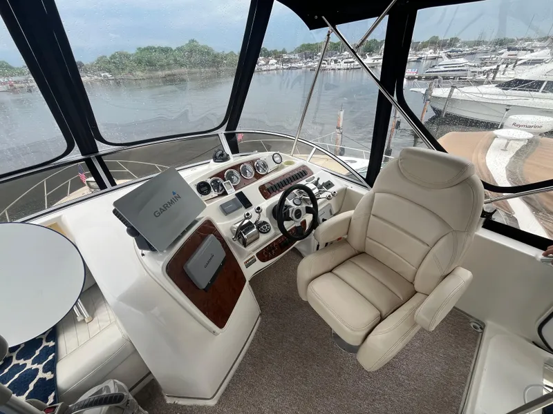 Slide: The Image of Helm of 2003 Meridian 381 Sedan yacht with steering wheel and navigation equipment. - 22