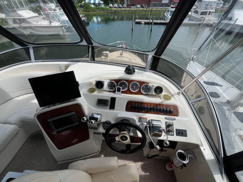Slide: The Image of Cockpit view of 2003 Meridian 381 Sedan yacht with steering wheel and control panel. - 4