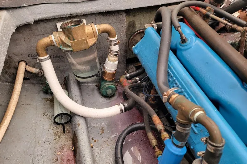 Slide: The Image of Engine compartment of a 1971 Dyer 29 classic downeast bass boat, showing pipes and components. - 11