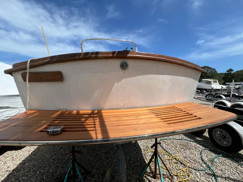 Slide: The Image of 1971 Dyer 29 Classic Downeast Bass Boat with wooden deck, parked outdoors. - 12