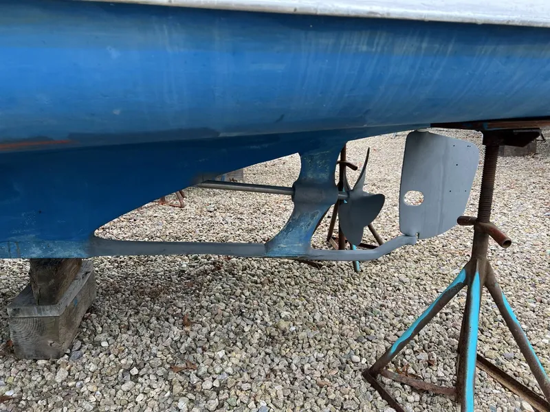 Slide: The Image of 1971 Dyer 29 classic downeast bass boat hull and propeller on stands. - 14