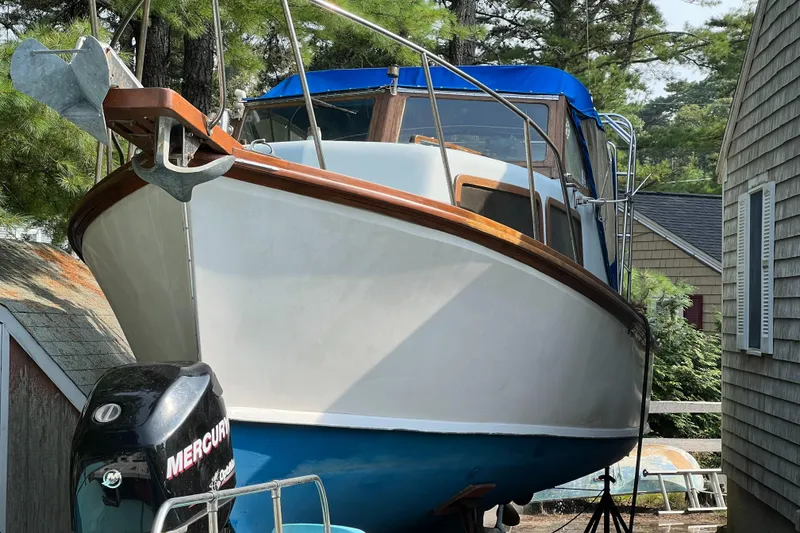 Slide: The Image of 1971 Dyer 29 Classic Downeast Bass Boat with blue canopy and Mercury outboard motor. - 15