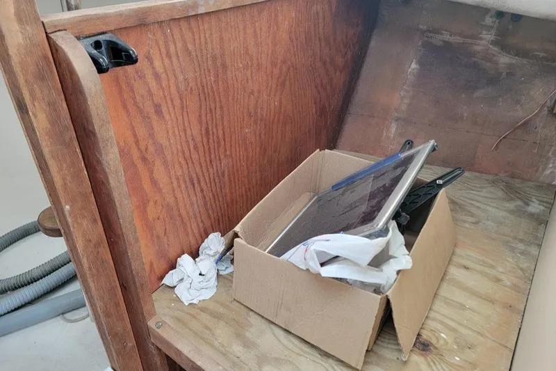 Slide: The Image of Box with tools and papers on wooden surface inside 1971 Dyer 29 classic downeast bass boat. - 26