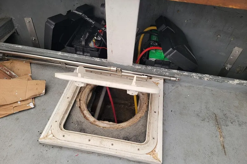 Slide: The Image of 1971 Dyer 29 classic downeast bass boat interior with open hatch and visible batteries. - 28