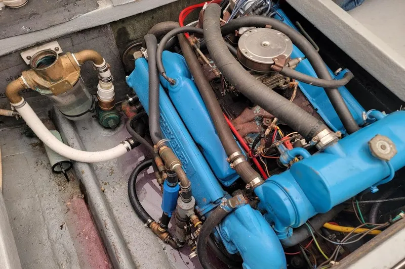 Slide: The Image of Engine compartment of a 1971 Dyer 29 Classic Downeast Bass Boat, showcasing blue engine components. - 8