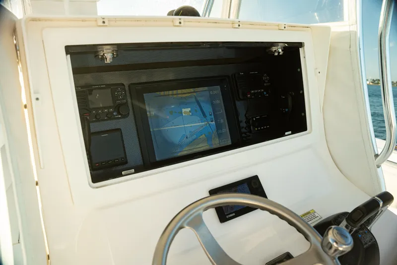 Slide: The Image of 2015 Contender 32 ST boat dashboard with navigation system and controls. - 12
