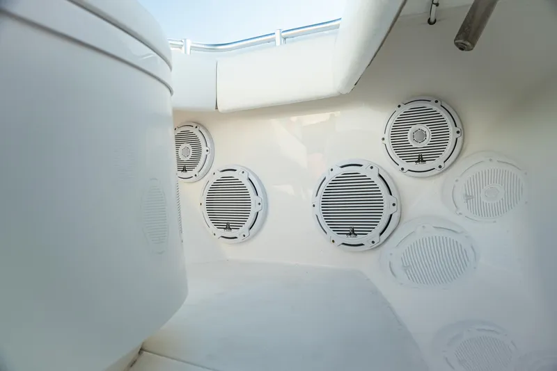 Slide: The Image of 2015 Contender 32 ST boat interior with multiple round speakers installed. - 5