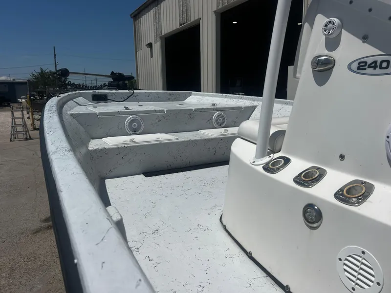 Slide: The Image of 2012 Blazer Bay 2400 boat with Yamaha engine, white interior, and control panel. - 8