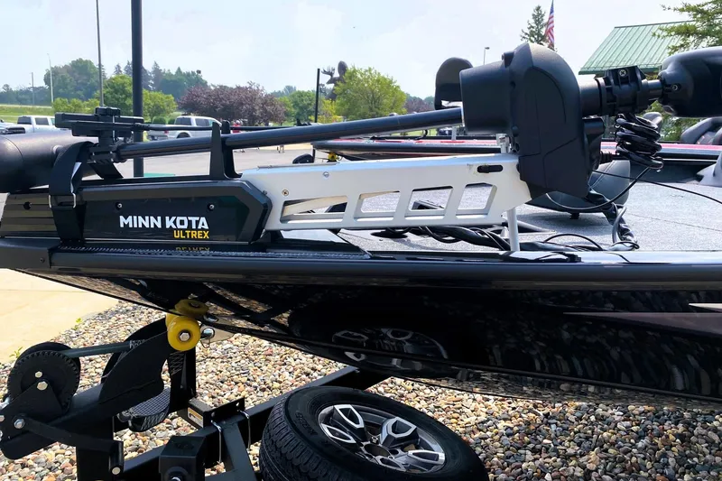 Slide: The Image of 2025 Tracker Savage 215 with Minn Kota Ultrex trolling motor on trailer. - 3