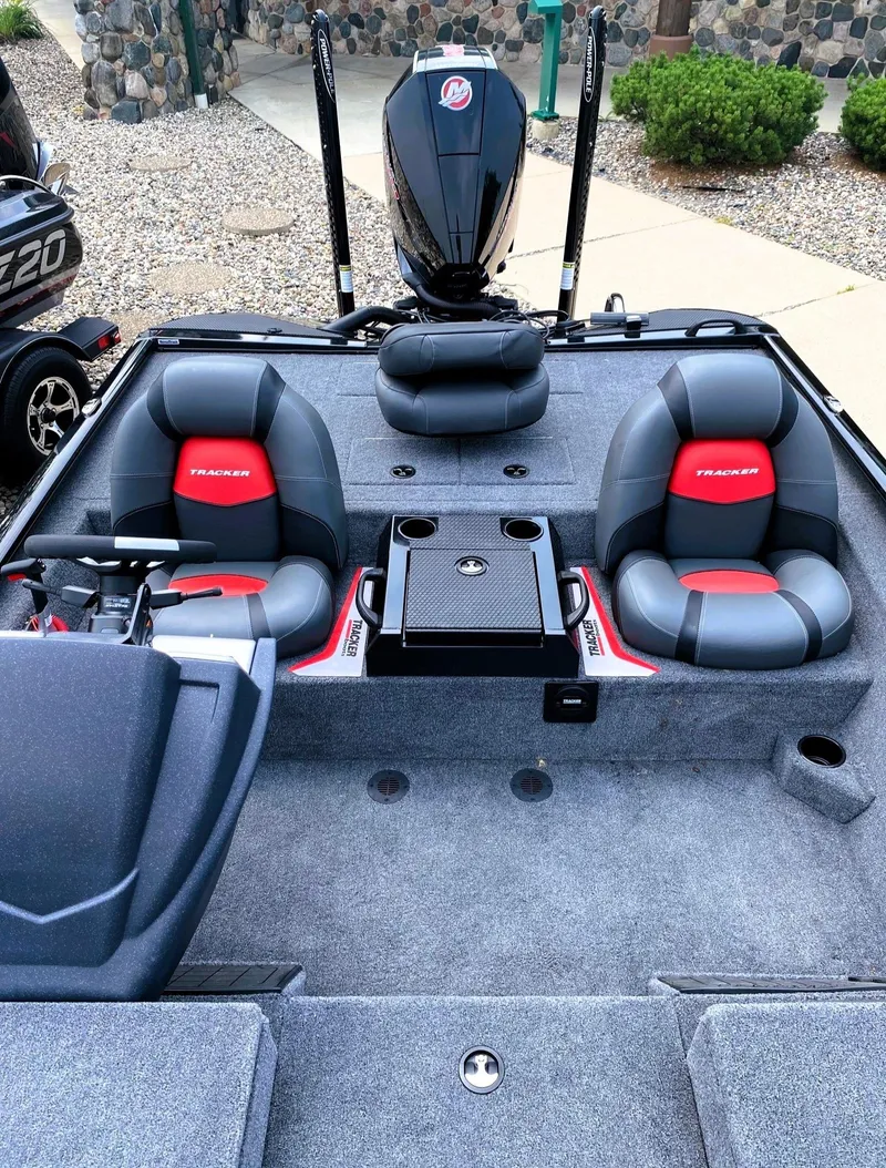 Slide: The Image of 2025 Tracker Savage 215 boat interior with dual seats and modern design. - 4