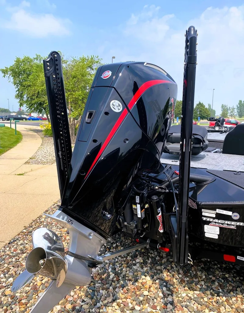 Slide: The Image of 2025 Tracker Savage 215 boat engine with sleek black and red design. - 9