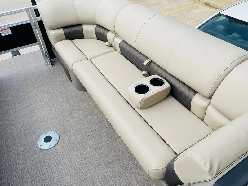 Slide: The Image of Luxurious seating on 2025 Sun Tracker SportFish 22 DLX pontoon boat with cup holders. - 15