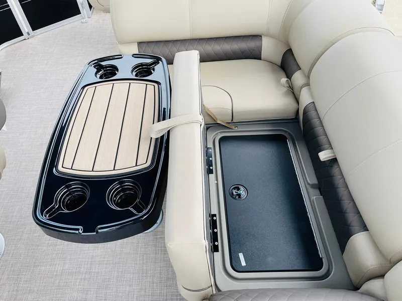 Slide: The Image of 2025 Sun Tracker SportFish 22 DLX interior with seating and storage compartments. - 28