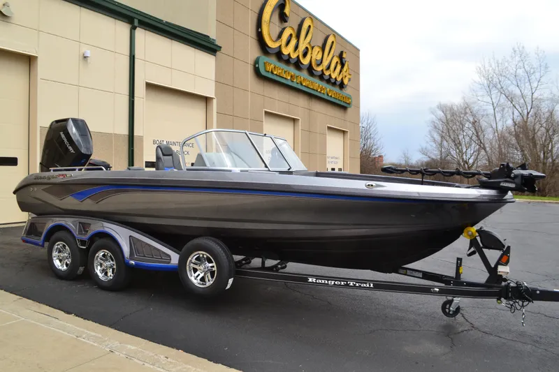 The Image of 2025 Ranger 621FS Pro boat on trailer outside Cabela's store. - 0