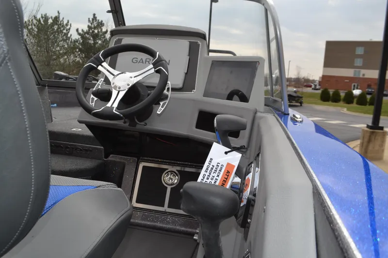 Slide: The Image of 2025 Ranger 621FS Pro boat interior with steering wheel and control panel. - 4