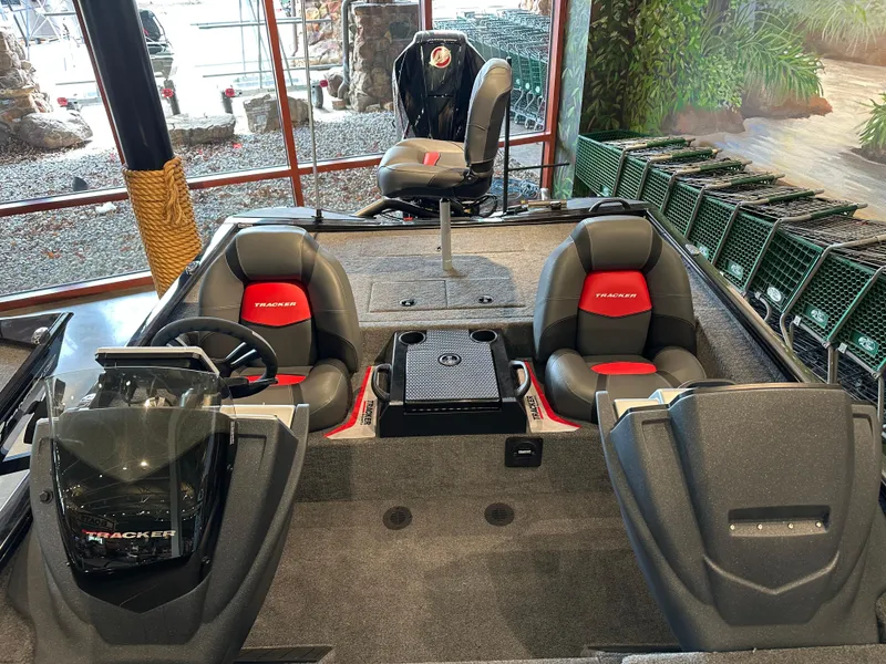 Slide: The Image of 2025 Tracker Savage 215 boat interior with seating and control console. - 5