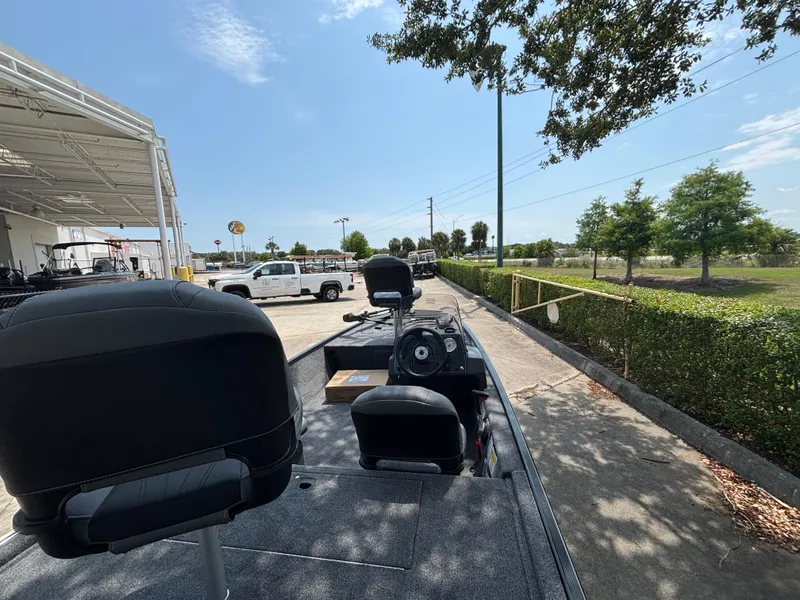 Slide: The Image of 2025 Tracker Bass Tracker Classic XL boat parked outdoors on a sunny day. - 3