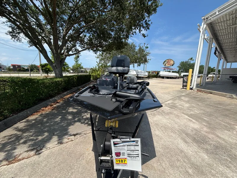 Slide: The Image of 2025 Tracker Bass Tracker Classic XL boat displayed outdoors on a sunny day. - 4