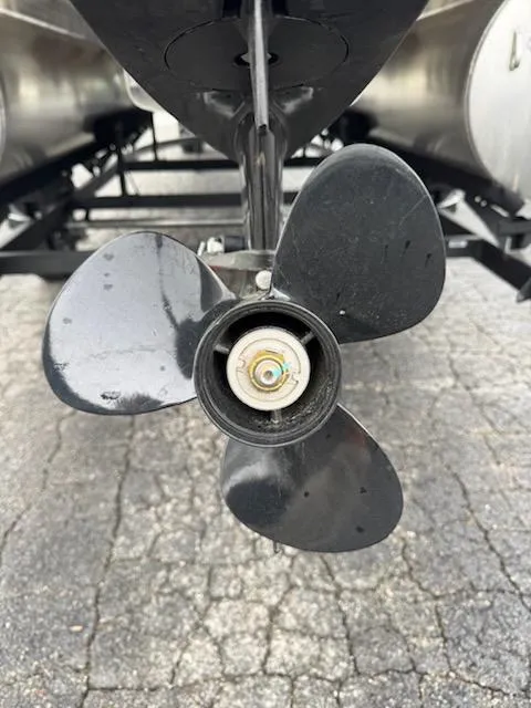 Slide: The Image of Propeller of 2025 Sun Tracker Bass Buggy 16 XL Select on pavement. - 4