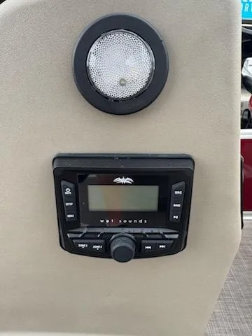 Slide: The Image of Control panel and speaker on 2025 Sun Tracker Bass Buggy 16 XL Select boat. - 7