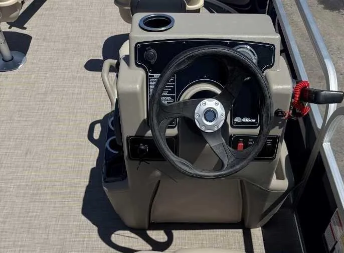 Slide: The Image of Steering console of 2025 Sun Tracker Bass Buggy 16 XL Select pontoon boat. - 4