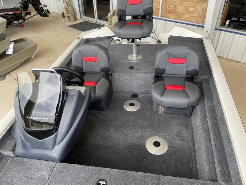 Slide: The Image of 2025 Tracker Pro Team 175 Crappie Edition boat interior with gray and red seating. - 10