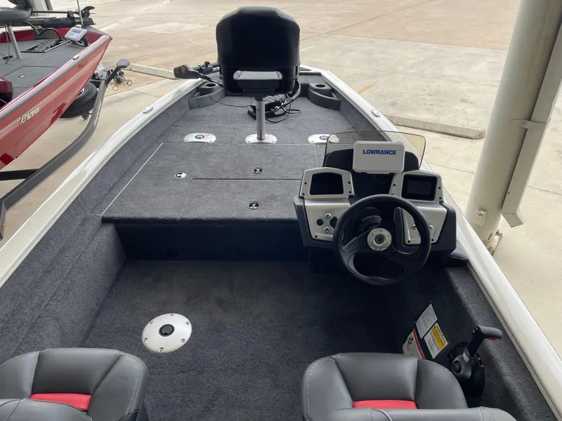 Slide: The Image of 2025 Tracker Pro Team 175 Crappie Edition boat interior with steering console and seating. - 11