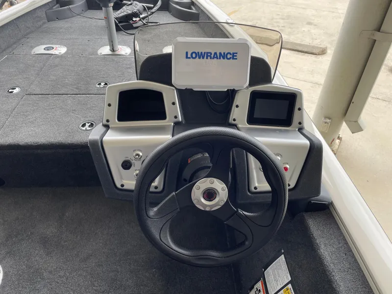 Slide: The Image of 2025 Tracker Pro Team 175 Crappie Edition boat dashboard with Lowrance electronics. - 13