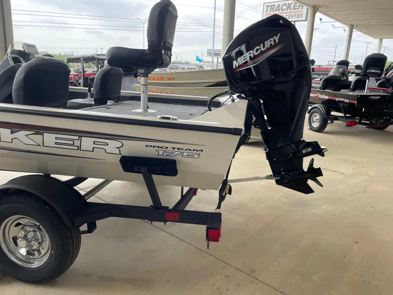 Slide: The Image of 2025 Tracker Pro Team 175 Crappie Edition boat with Mercury engine on trailer. - 2