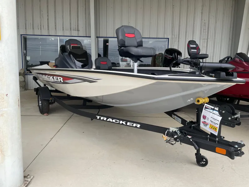 Slide: The Image of 2025 Tracker Pro Team 175 Crappie Edition boat on trailer, displayed outdoors. - 5