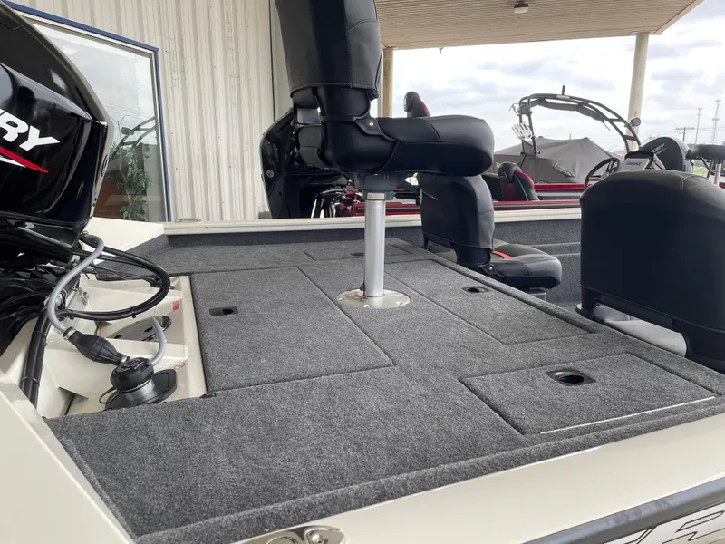 Slide: The Image of 2025 Tracker Pro Team 175 Crappie Edition boat interior with seating and storage compartments. - 7
