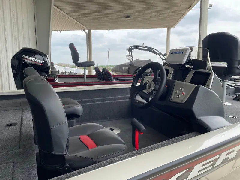 Slide: The Image of 2025 Tracker Pro Team 175 Crappie Edition boat interior with steering wheel and seats. - 8