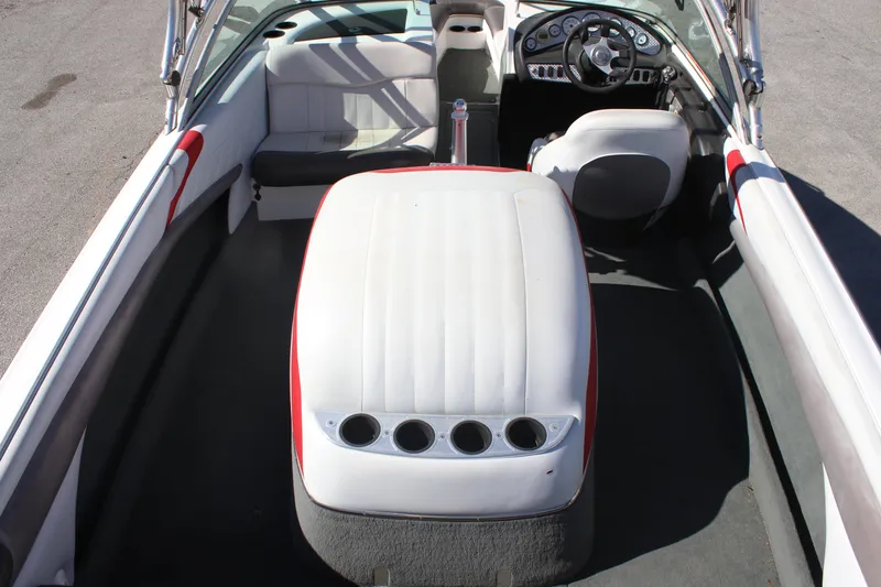 Slide: The Image of 2004 MasterCraft X-9 boat interior with white seating and dashboard. - 5