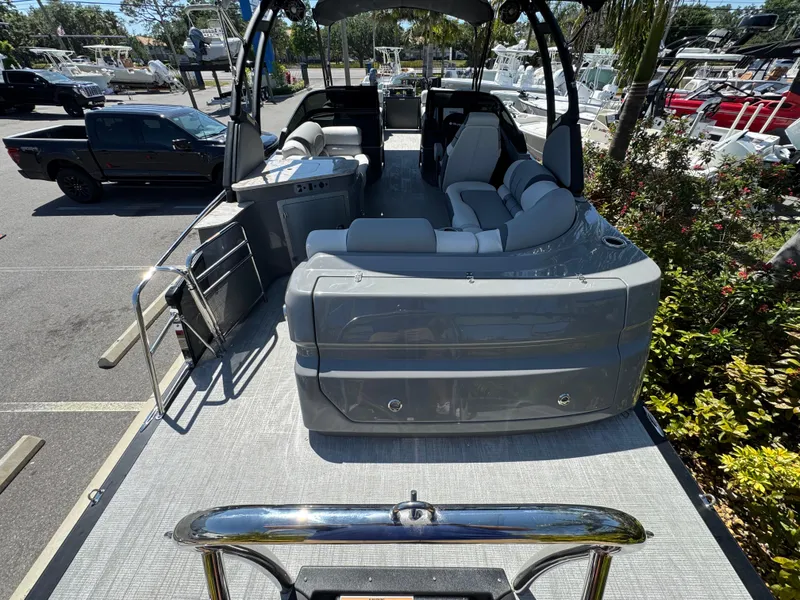 Slide: The Image of 2025 Avalon Excalibur 27' pontoon boat with sleek seating and modern design. - 12