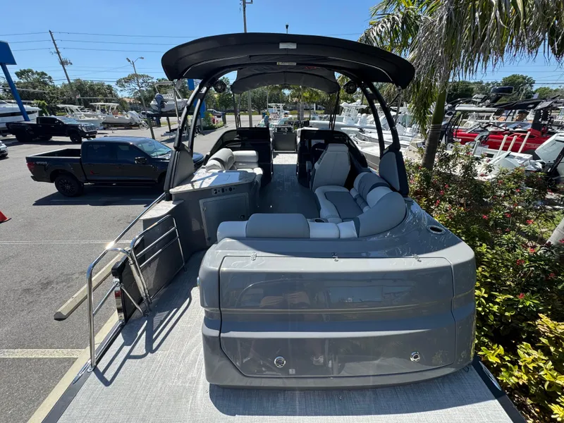 Slide: The Image of 2025 Avalon Excalibur 27' boat with sleek design, spacious seating, and modern features. - 13