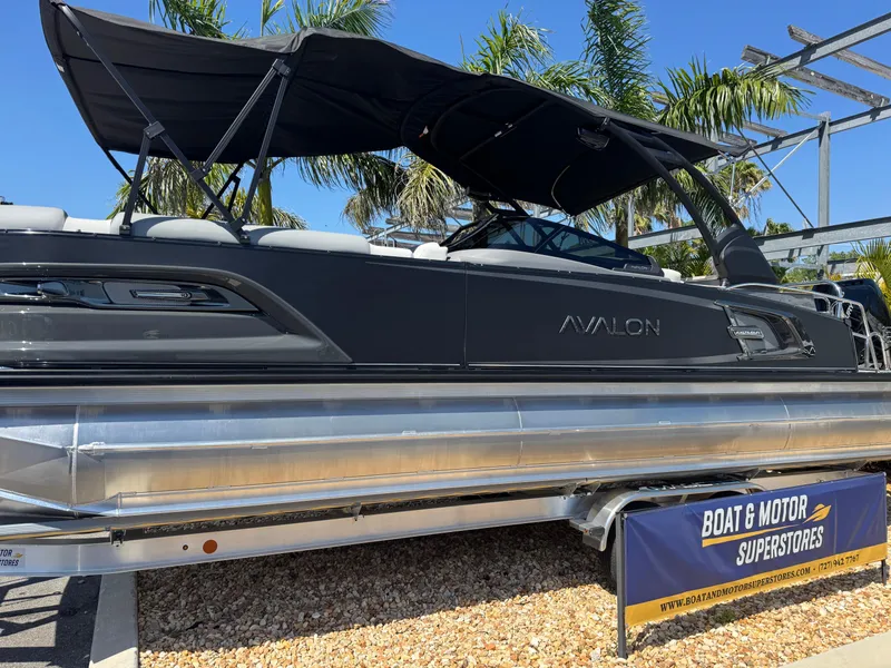 Slide: The Image of 2025 Avalon Excalibur 27' pontoon boat displayed at Boat & Motor Superstores. - 2