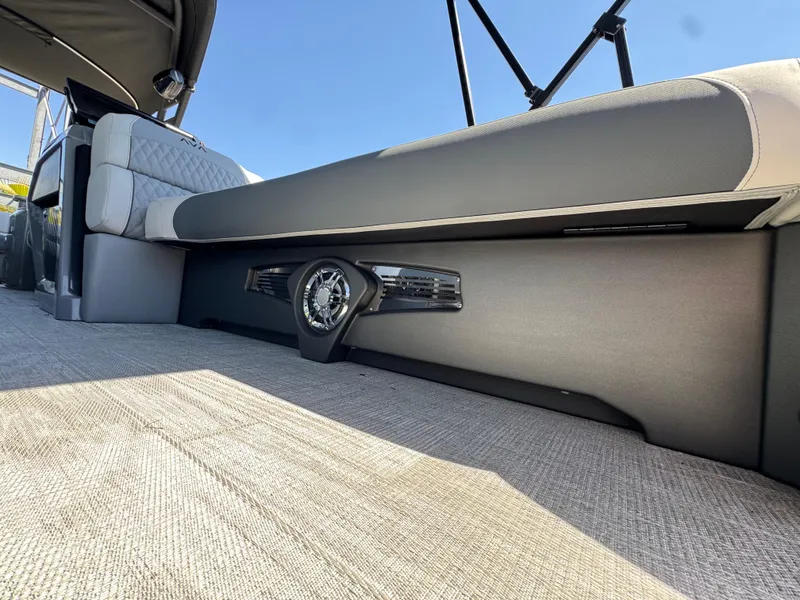 Slide: The Image of 2025 Avalon Excalibur 27' boat interior with sleek seating and integrated speaker system. - 30