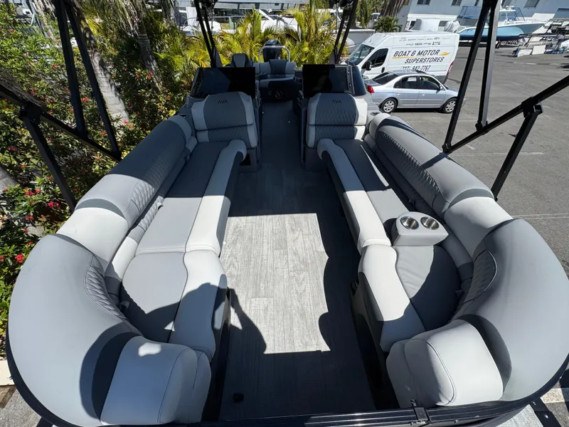 Slide: The Image of 2025 Avalon Excalibur 27' boat interior with luxurious gray seating and spacious layout. - 31