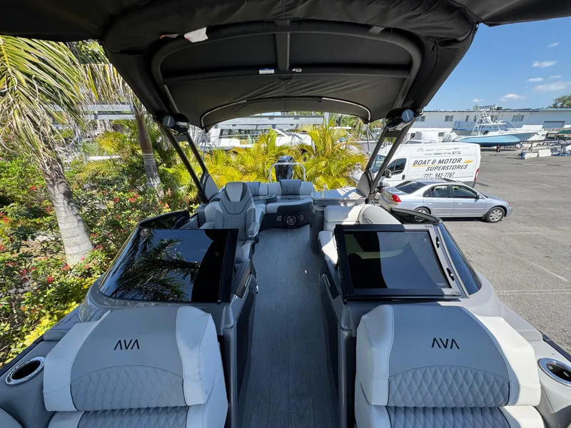 Slide: The Image of Luxurious 2025 Avalon Excalibur 27' boat interior with plush seating and modern design. - 35
