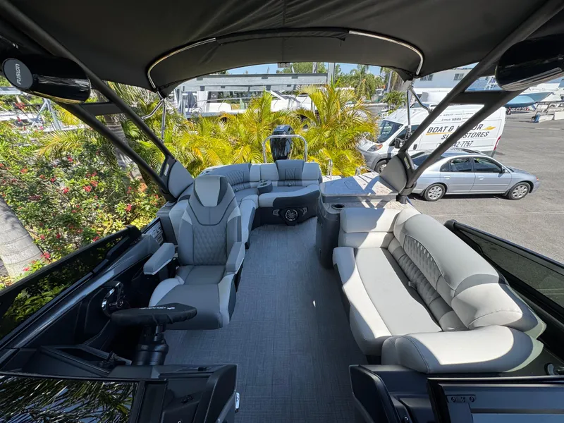 Slide: The Image of Luxurious 2025 Avalon Excalibur 27' boat interior with plush seating and modern design. - 36